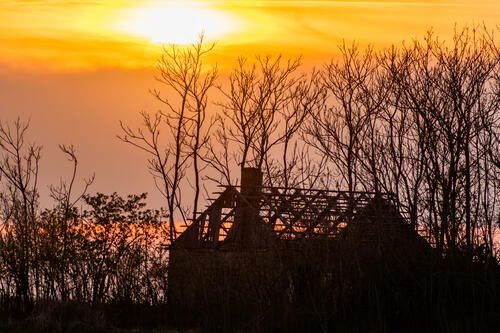 Abandoned house in the sunset